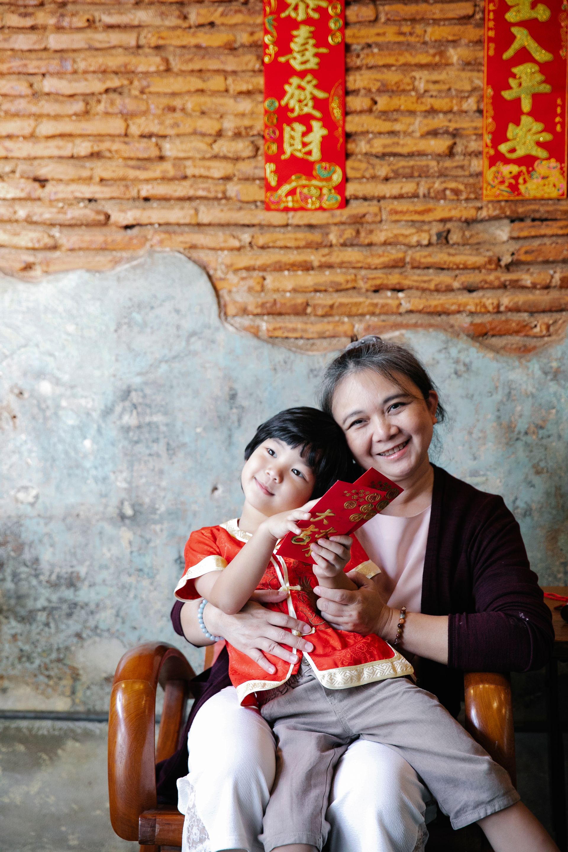 Asian grandmother with grandchild — family care and dignified aging